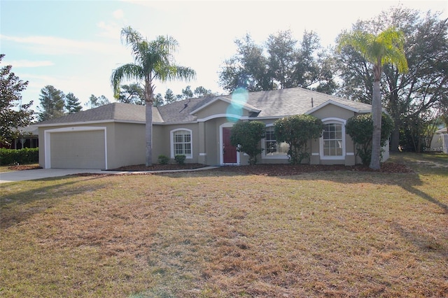 ranch-style home with a garage and a front lawn