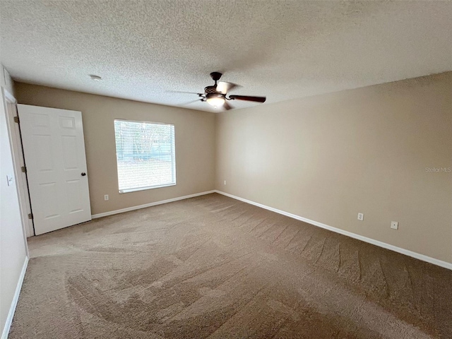 empty room featuring carpet flooring, a textured ceiling, and ceiling fan