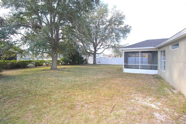 view of yard featuring a sunroom