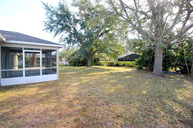 view of yard with a sunroom