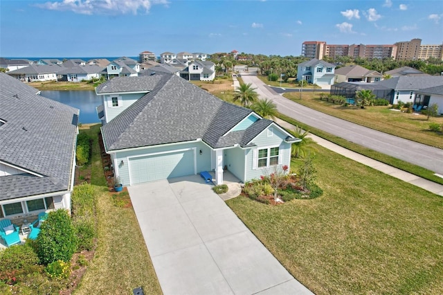 drone / aerial view featuring a water view