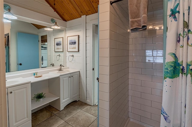 bathroom featuring double vanity, tiled shower, wood ceiling, vaulted ceiling, and a sink