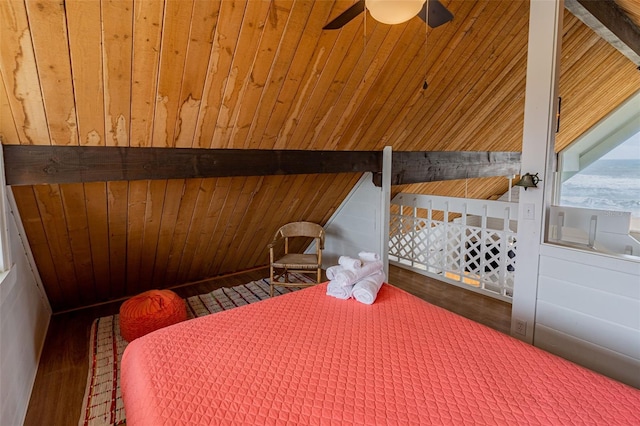 bedroom featuring ceiling fan, wood finished floors, wood ceiling, and wooden walls