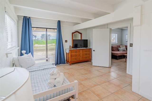 bedroom with access to exterior, beamed ceiling, and light tile patterned flooring