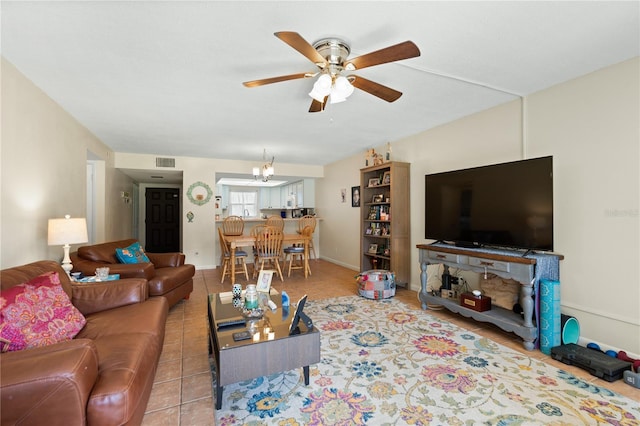 tiled living room featuring ceiling fan