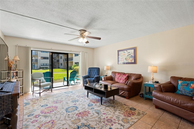 tiled living room featuring ceiling fan and a textured ceiling