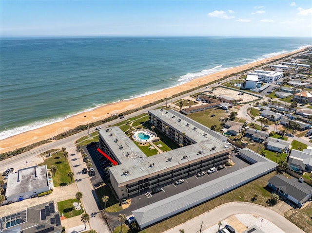 aerial view with a water view and a view of the beach