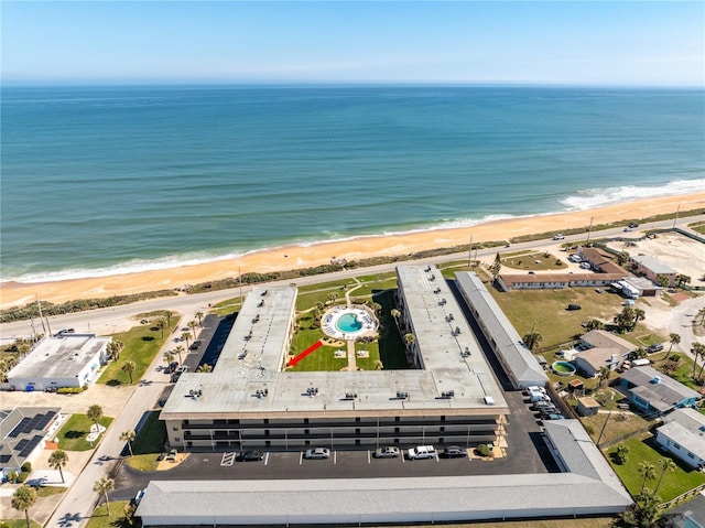 bird's eye view with a beach view and a water view