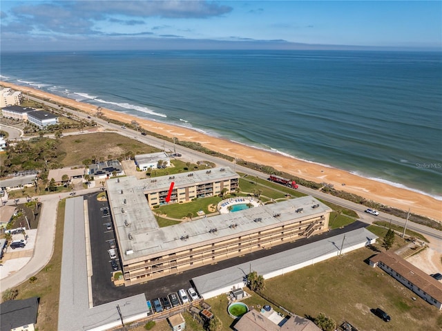 aerial view featuring a water view and a view of the beach