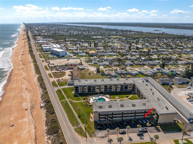 aerial view featuring a view of the beach and a water view