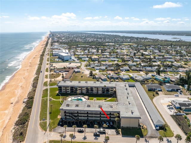 aerial view with a water view and a view of the beach