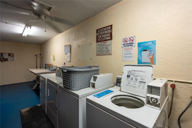 laundry room featuring ceiling fan, washing machine and dryer, and a textured ceiling