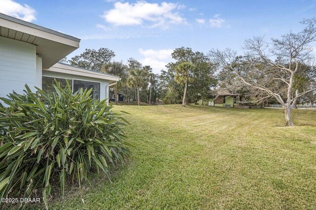 view of yard with a sunroom