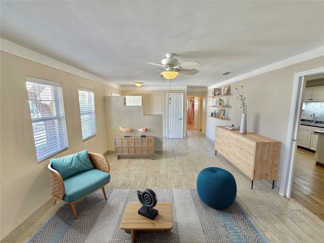 155 Avalon Ave, Flagler Beach, FL 32136 - living area featuring ceiling fan, sink, and light hardwood / wood-style floors