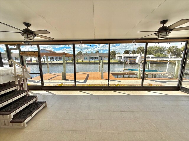 155 Avalon Ave, Flagler Beach, FL 32136 - unfurnished sunroom featuring a water view and ceiling fan