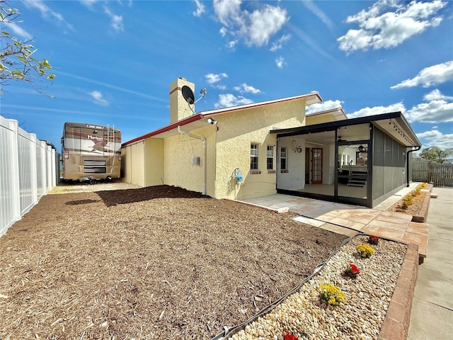 155 Avalon Ave, Flagler Beach, FL 32136 - rear view of house with ceiling fan and a patio