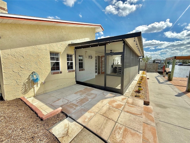 155 Avalon Ave, Flagler Beach, FL 32136 - rear view of house featuring a patio, a sunroom, and ceiling fan