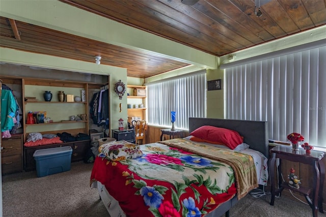 bedroom featuring wooden ceiling and carpet