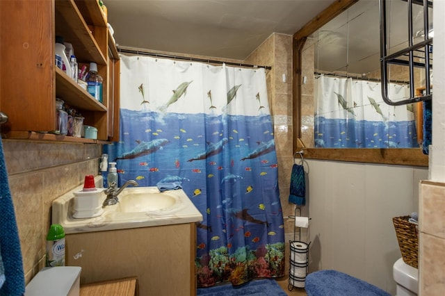 bathroom with vanity, toilet, and walk in shower