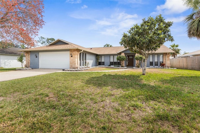 ranch-style house with fence, driveway, a front lawn, a garage, and brick siding