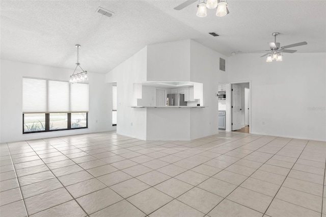 unfurnished living room featuring visible vents, a textured ceiling, light tile patterned flooring, and ceiling fan with notable chandelier