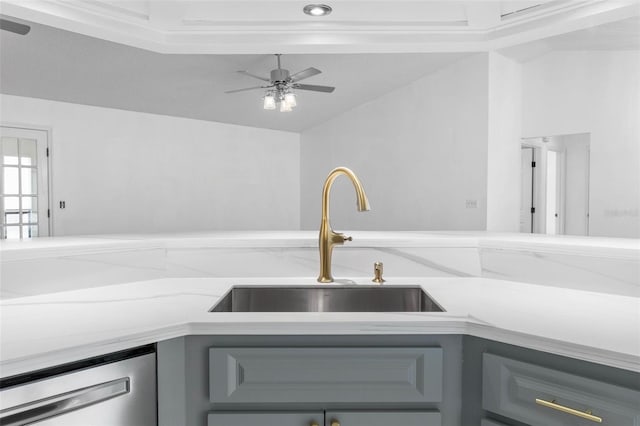 kitchen with a ceiling fan, gray cabinets, a sink, light countertops, and dishwasher