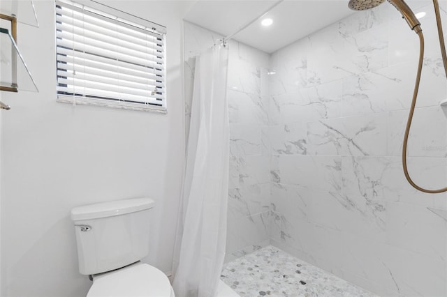 full bathroom with recessed lighting, toilet, and a stall shower