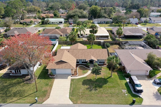 birds eye view of property with a residential view