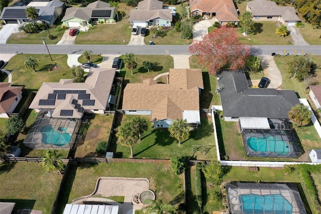 birds eye view of property with a residential view