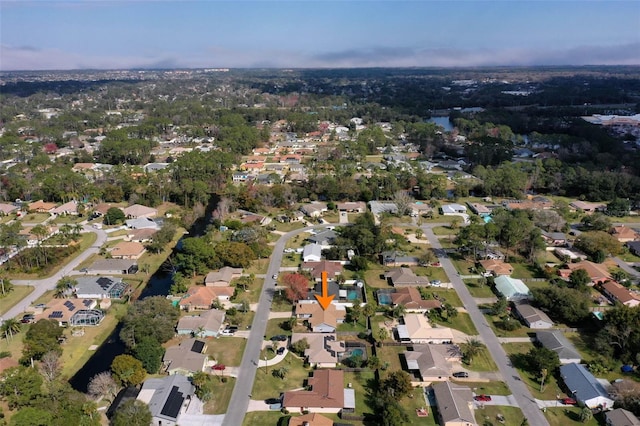 birds eye view of property with a residential view