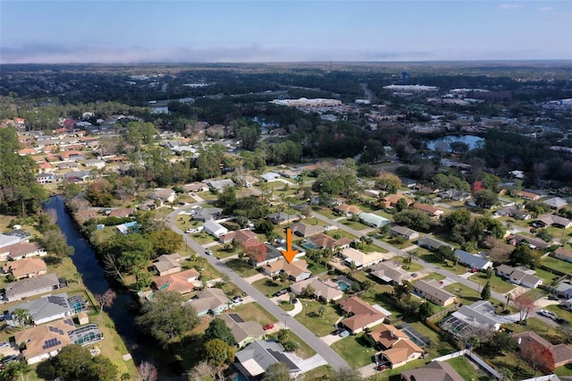 aerial view with a residential view and a water view