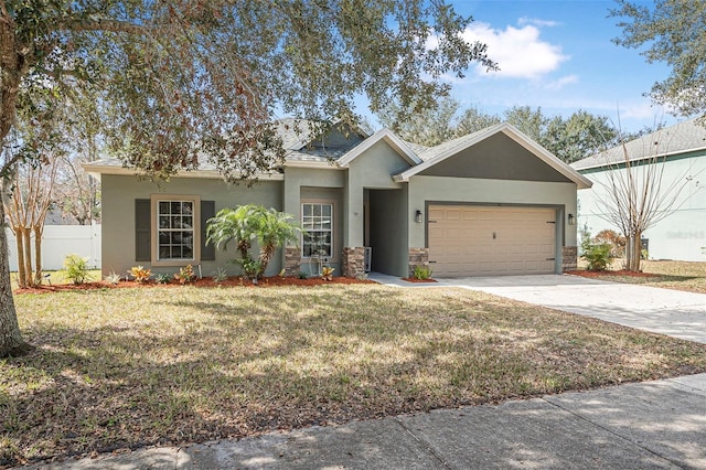 single story home featuring a garage and a front yard