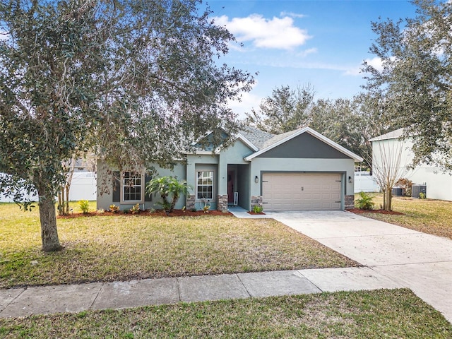 view of front of property with a garage and a front yard