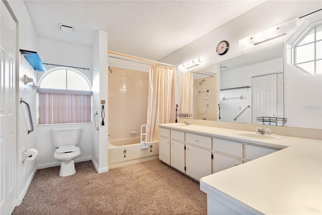 full bathroom featuring vanity, shower / bath combo, toilet, and a textured ceiling