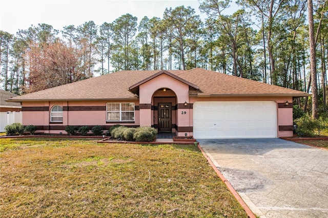 single story home featuring a garage and a front lawn