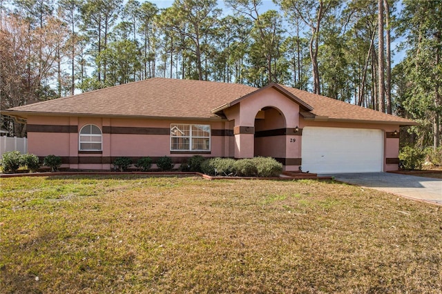 single story home with a garage and a front lawn