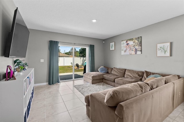 tiled living room with a textured ceiling