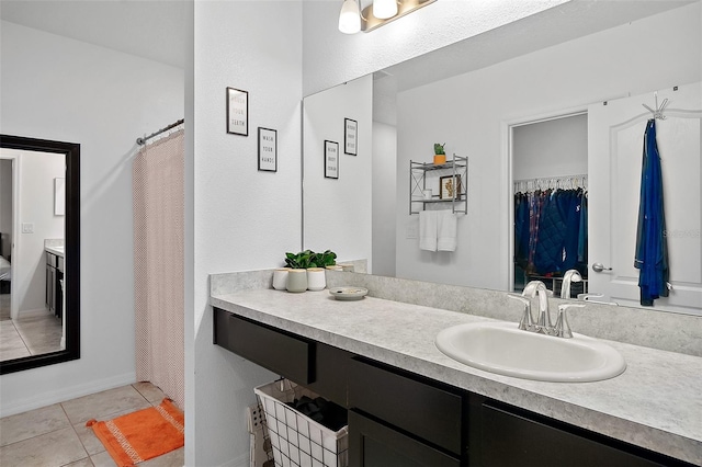 bathroom with tile patterned floors and vanity