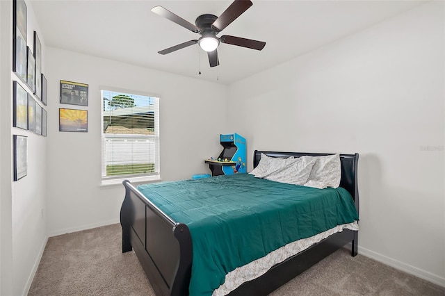 bedroom featuring ceiling fan and light carpet