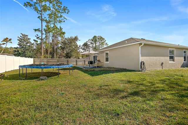 view of yard featuring a trampoline