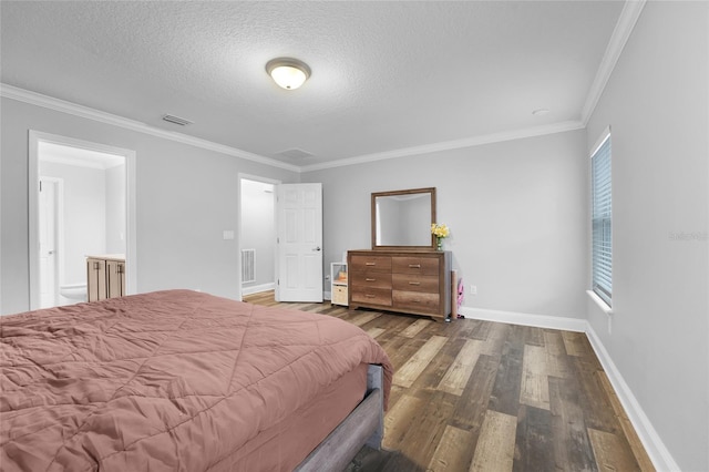 bedroom featuring dark hardwood / wood-style flooring, ornamental molding, and a textured ceiling