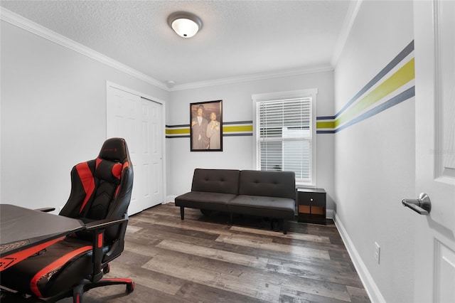 office area featuring dark wood-type flooring, ornamental molding, and a textured ceiling