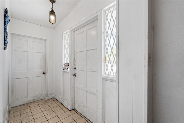 foyer entrance with light tile patterned floors