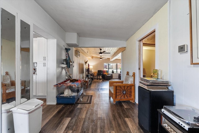 corridor featuring dark wood-style flooring and beam ceiling