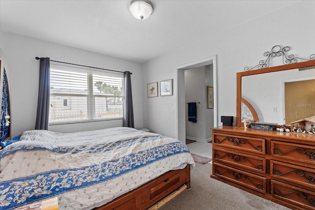 bedroom featuring light colored carpet