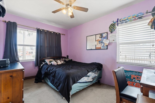 carpeted bedroom with a ceiling fan