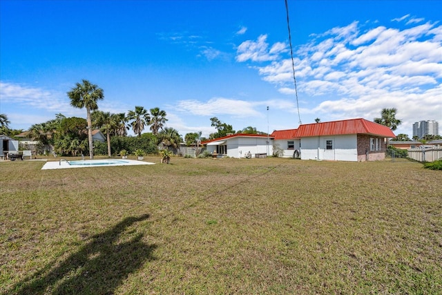 view of yard featuring a fenced in pool and fence