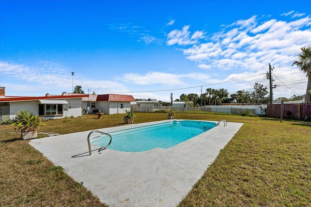 view of pool featuring a lawn, a fenced backyard, and a fenced in pool