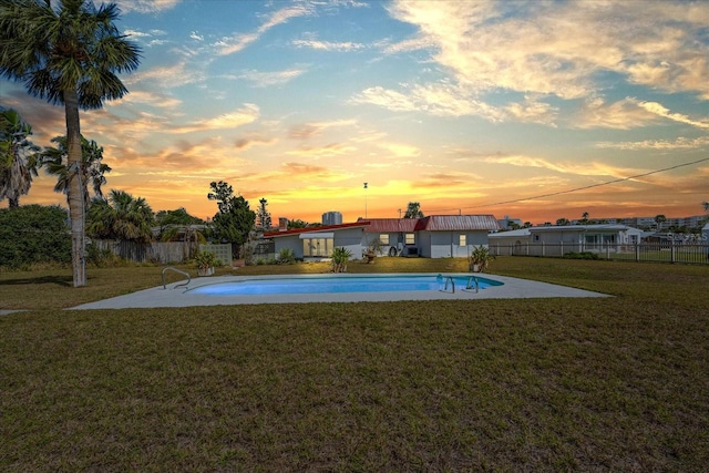 view of pool featuring a patio, fence, a fenced in pool, and a yard