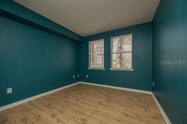 empty room featuring hardwood / wood-style floors